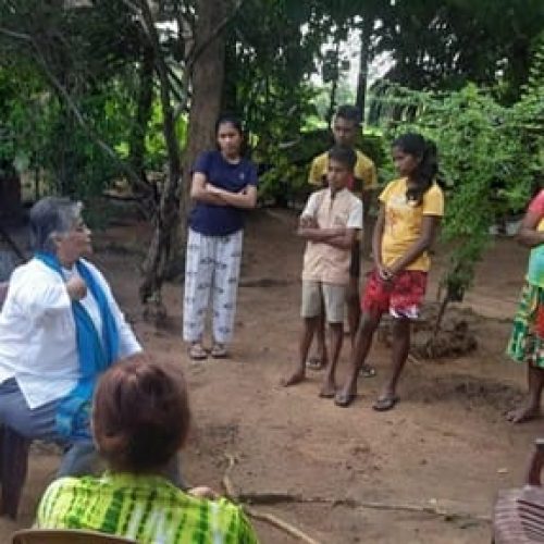Apostle Rhuani talking to farmers and encouraging them with words of wisdom related to their situation