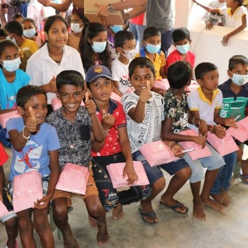 Gifts are occasionally sent by donors to the children they sponsor. In this picture, school books were given in addition to the 1,000 LKR.